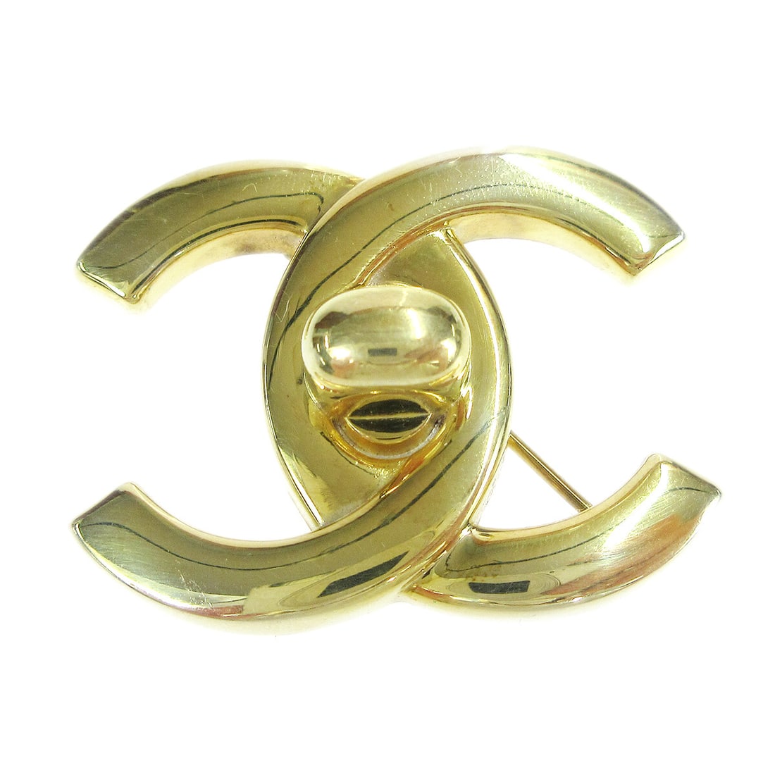 Chanel CC Turnlock Gold Plated Brooch Pin 97P: Chanel CC Turnlock Gold Plated Brooch Pin 97P Gold-plated Chanel brooch pin featuring the CC logos with a turnlock motif. Made in France, this large brooch has a gold-tone finish and shows scratches c