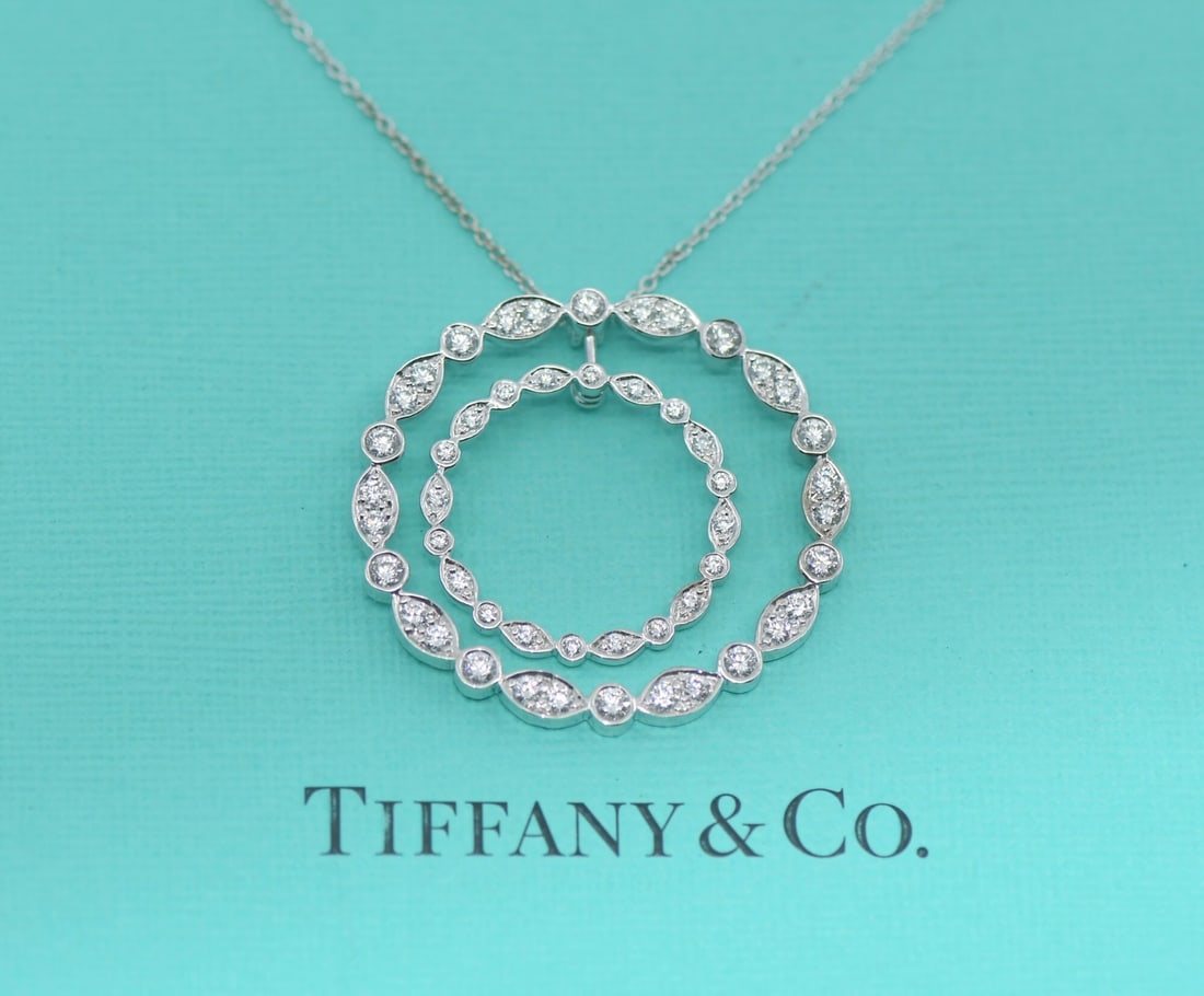 Platinum Pendant Necklace with Diamond by Tiffany & Co Swing Collection: Platinum Pendant Necklace with Diamond by Tiffany & Co Swing Collection This Tiffany & Co. Swing Diamond Pendant Necklace is crafted from platinum with a metal purity of 950. The necklace features a d