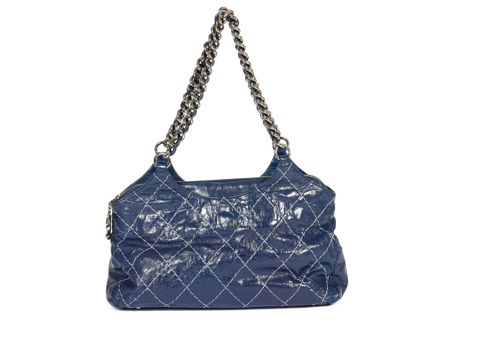 Chanel Distressed Dark Blue Quilted Leather Shoulder Bag with Silver Chains: Chanel Distressed Dark Blue Quilted Leather Shoulder Bag with Silver Chains This Chanel shoulder bag features a dark blue distressed glazed leather exterior with a quilted pattern. It is accented by t
