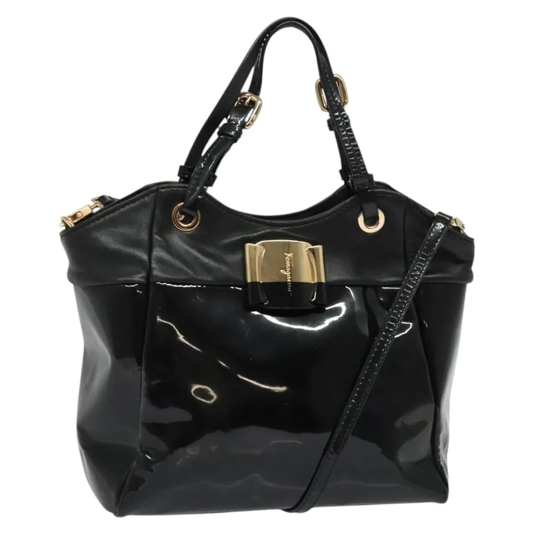 Black Patent Leather Vala Shoulder Bag by Salvatore Ferragamo: Black Patent Leather Vala Shoulder Bag by Salvatore Ferragamo This Salvatore Ferragamo Vala handbag is crafted from black patent leather and features a classic, structured design. Suitable for women, 