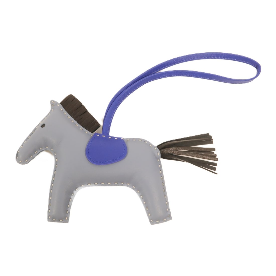 Hermes Rodeo MM Blue Lambskin Charm: Hermes Rodeo MM Blue Lambskin Charm This HERMES Rodeo MM Charm is crafted from Agneau Milo lambskin leather in a distinctive blue hue. Designed as a stylish accessory, it is suitable for unisex use an