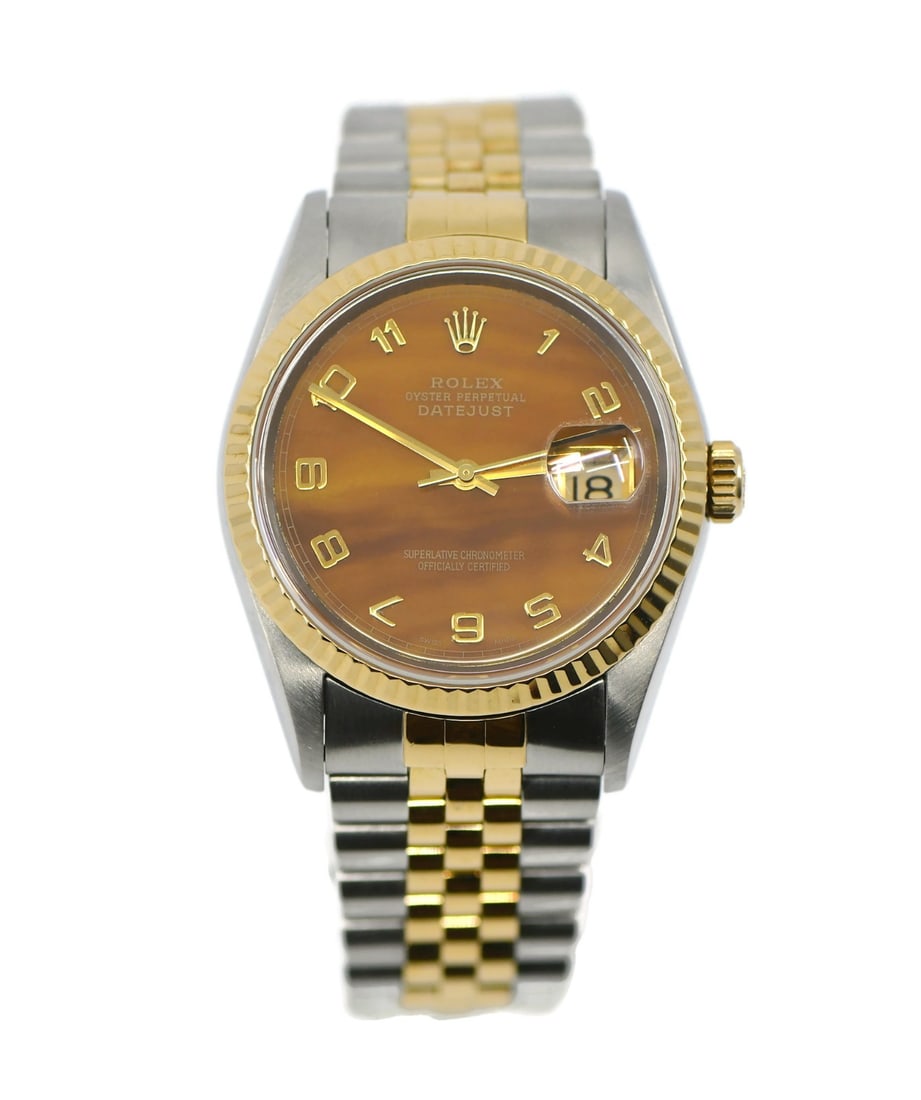 Rolex Datejust 16233 Tiger's Eye 36mm Gold Steel Watch: Rolex Datejust 16233 Tiger's Eye 36mm Gold Steel Watch This Rolex Datejust wristwatch features a striking Tiger's Eye dial, complemented by an 18K gold fluted bezel and stainless steel case. Designed 