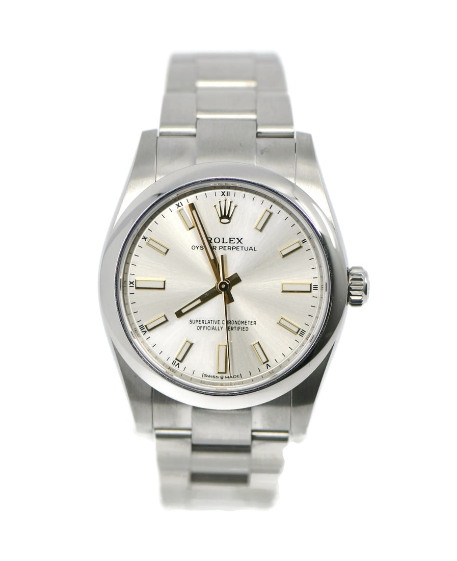 Rolex 124200 Oyster Perpetual 34mm Automatic Steel Wristwatch: Rolex 124200 Oyster Perpetual 34mm Automatic Steel Wristwatch Pre-owned Rolex Oyster Perpetual wristwatch with a stainless steel case and bracelet, featuring a silver sunburst dial with stick indexes.