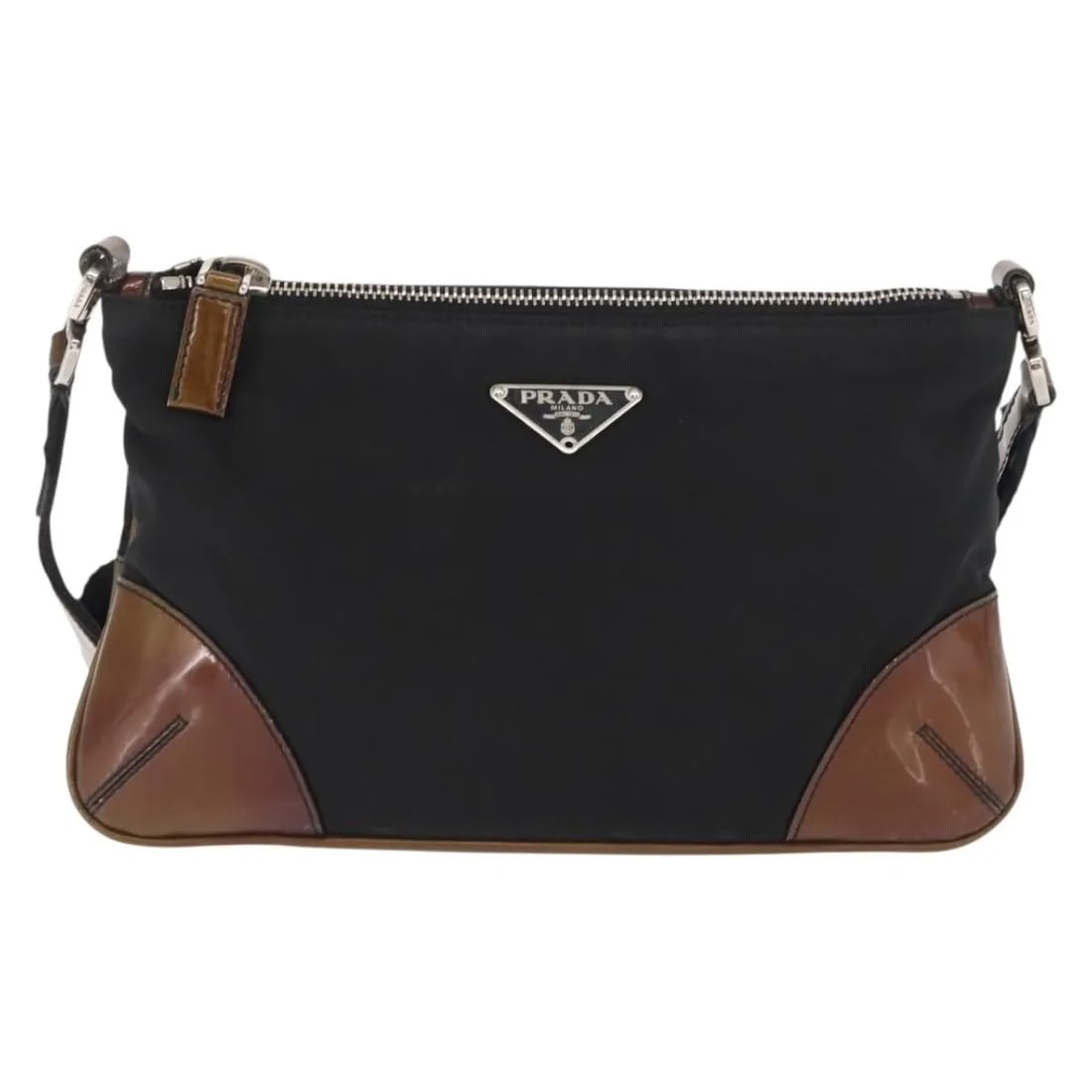 Prada Vintage Shoulder Bag Black Nylon Made in Italy: Prada Vintage Shoulder Bag Black Nylon Made in Italy This Prada vintage shoulder bag features a classic design crafted from black nylon, complemented by leather details and metal fittings. Made in Ita