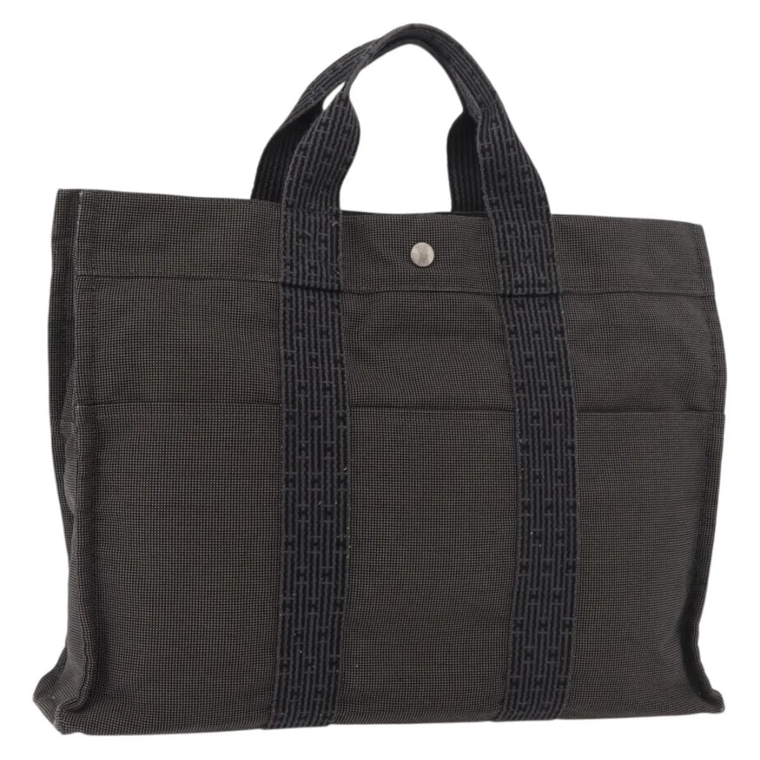 Gray Canvas Fourre-tout Herline Tote Bag by Hermes: Gray Canvas Fourre-tout Herline Tote Bag by Hermes This is a Hermes Fourre-tout Herline bag crafted from gray canvas. Designed for women, it features a spacious interior and sturdy handles. The bag sh
