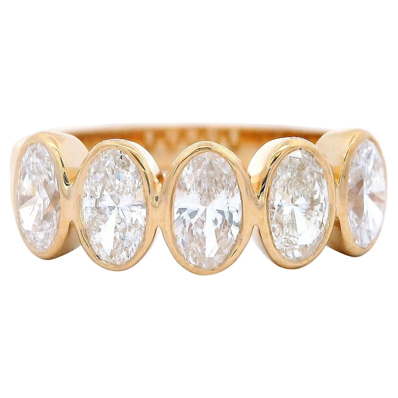 1.25ct Oval Diamond Eternity Band 18k Yellow Gold: 1.25ct Oval Diamond Eternity Band 18k Yellow Gold This exquisite half eternity band features five stunning oval cut white diamonds, totaling 1.25 carats, each set in a sleek bezel setting. Crafted fro