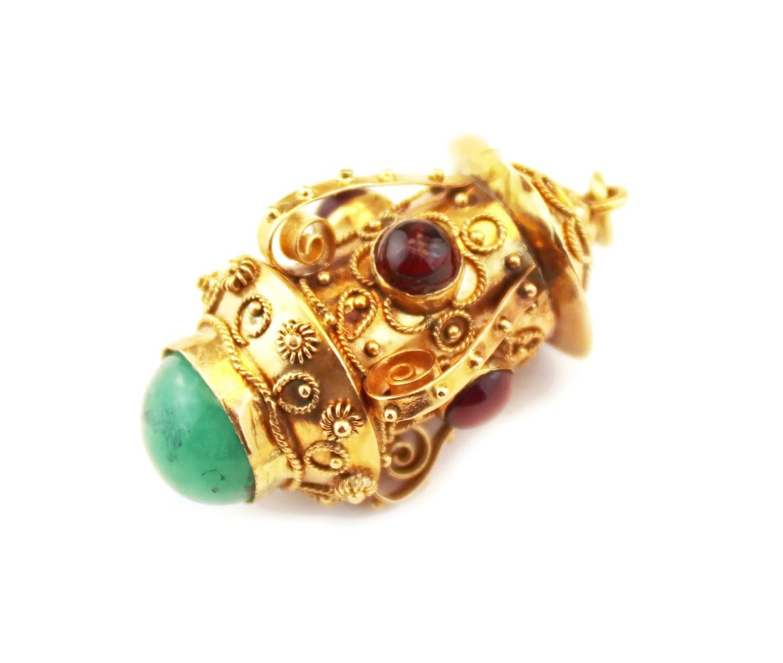Vintage 18k Yellow Gold Lantern Pendant with Emerald and Garnet: Vintage 18k Yellow Gold Lantern Pendant with Emerald and Garnet This stunning vintage fob pendant showcases a unique lantern design, expertly crafted from 18k yellow gold with a polished finish. The