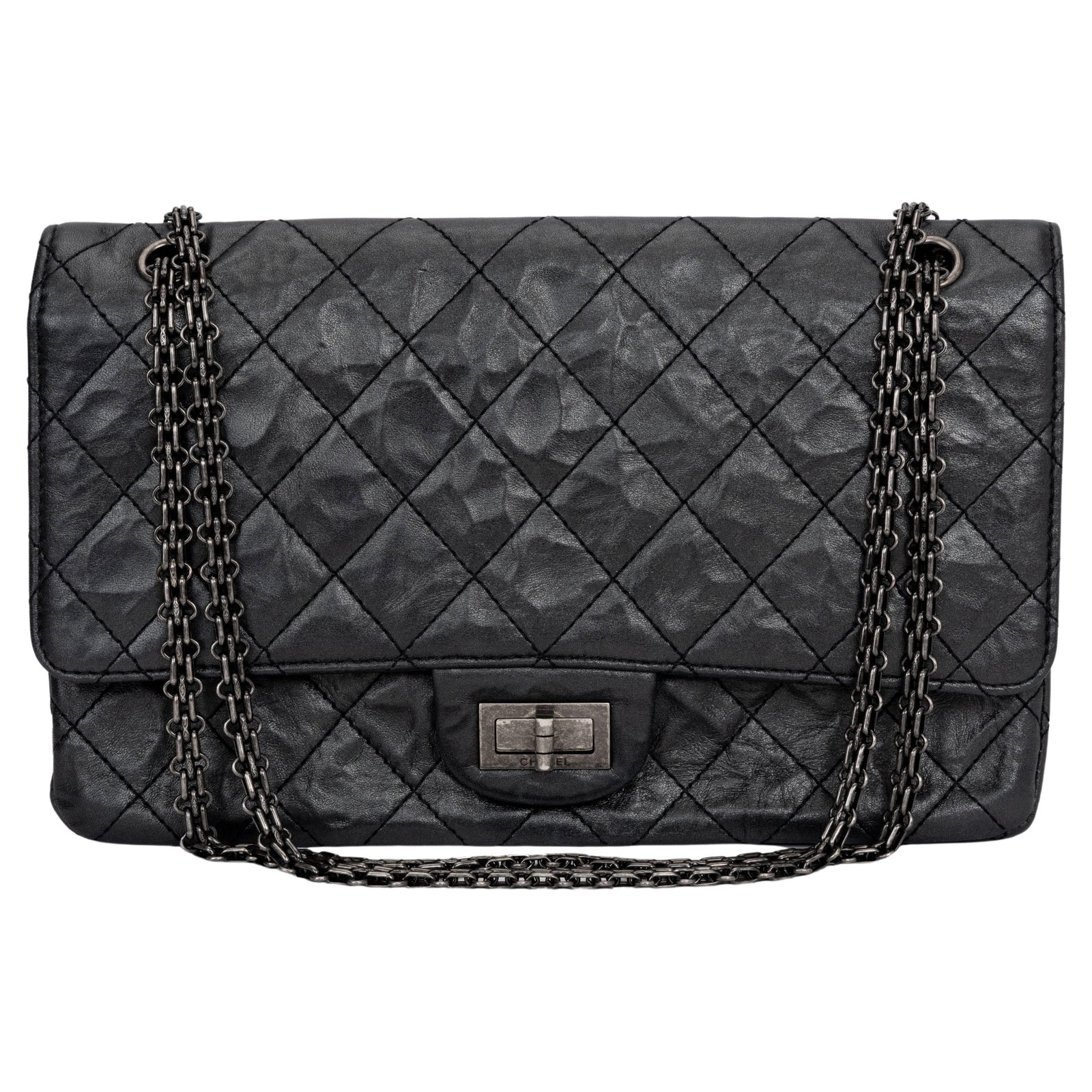 Chanel Jumbo Reissue 227 Black Aged Calfskin Handbag with Ruthenium Hardware: Chanel Jumbo Reissue 227 Black Aged Calfskin Handbag with Ruthenium Hardware This stunning Chanel Jumbo Reissue 227 handbag is crafted from luxurious black calfskin, showcasing an elegant design with 