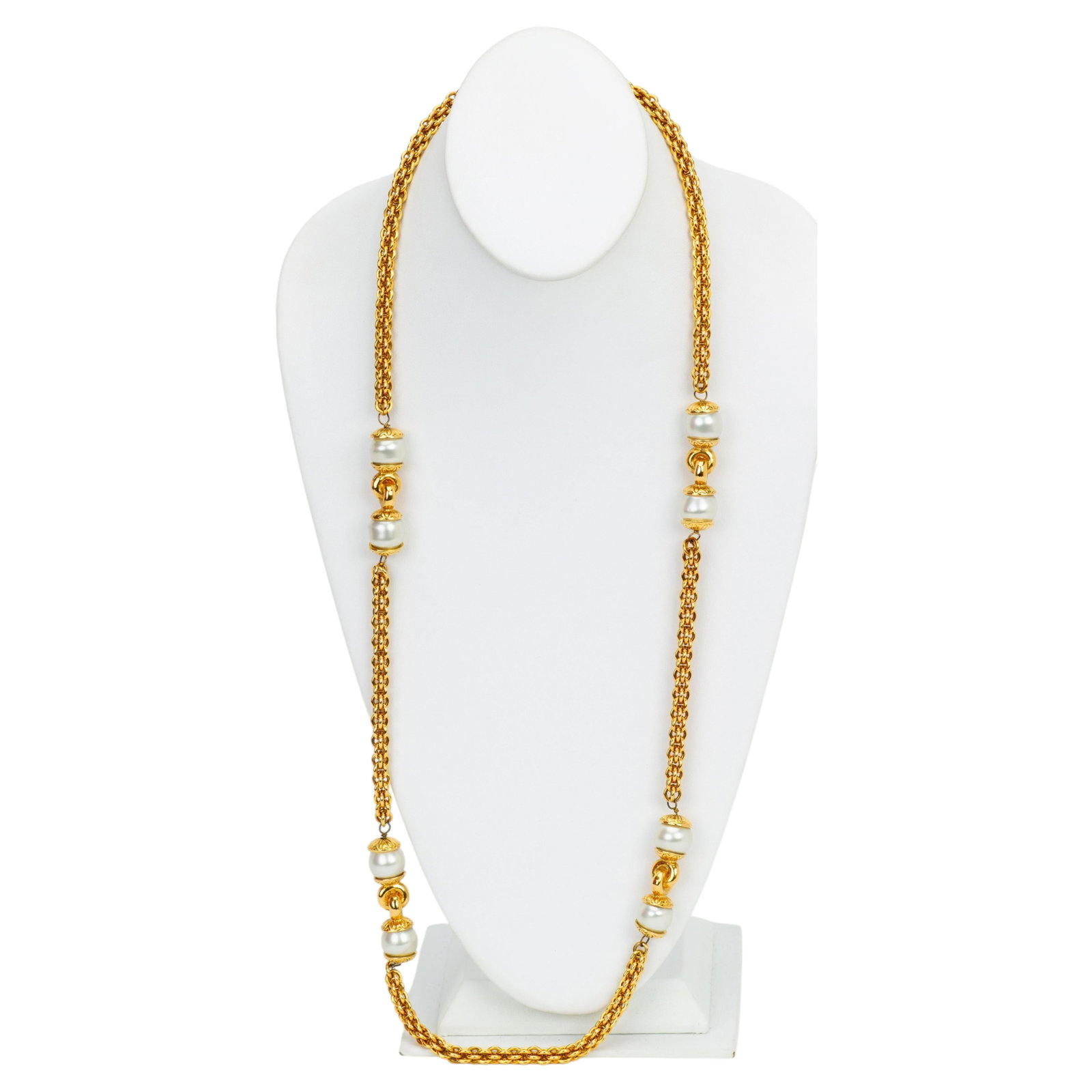 1970s Long Pearl and Gold Plated Necklace by Chanel France: 1970s Long Pearl and Gold Plated Necklace by Chanel France This rare Chanel sautoir necklace from the 1970s features elegant pearls and gold plated metal. The long design allows it to be double wrappe