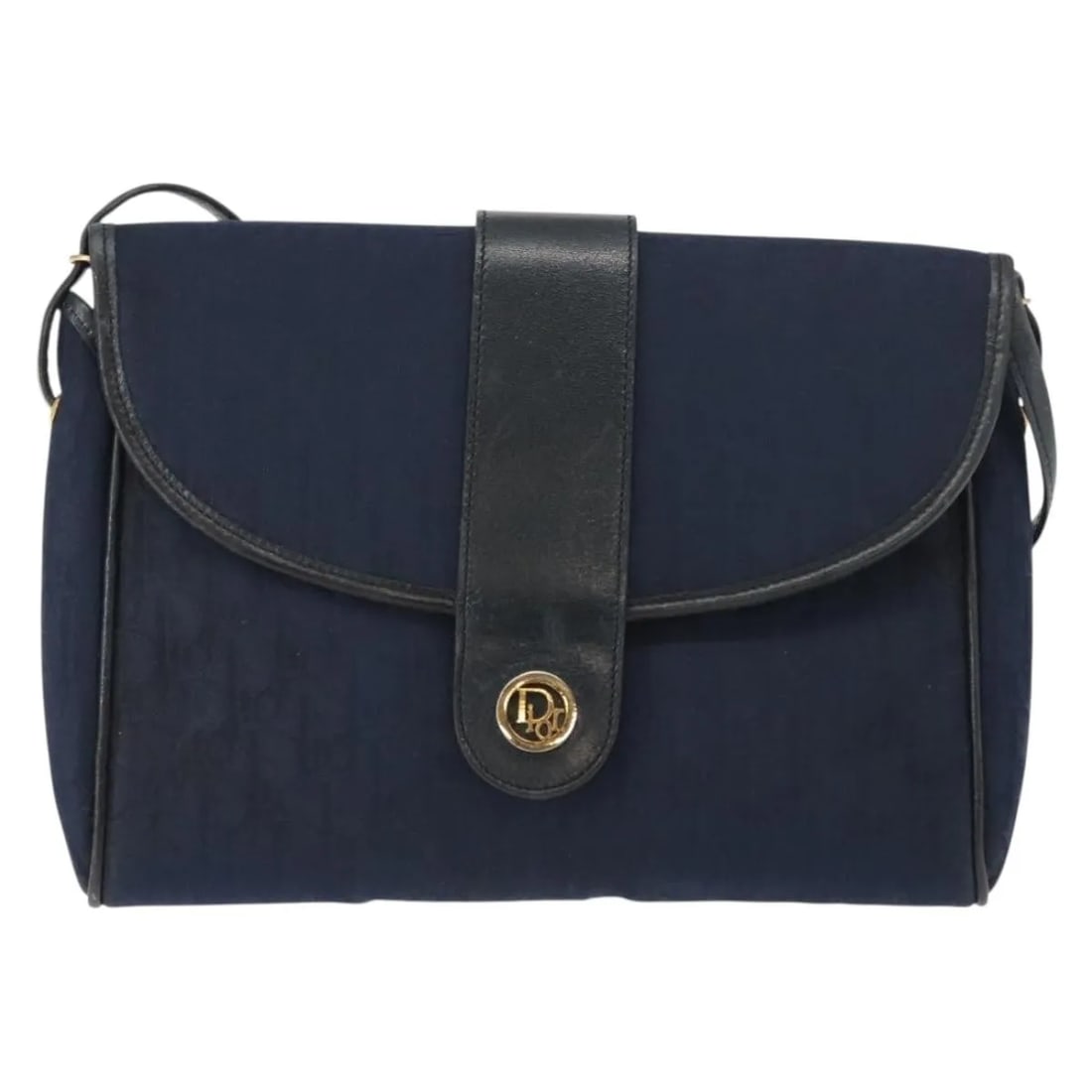 Christian Dior Vintage Trotter Shoulder Bag Navy Canvas: Christian Dior Vintage Trotter Shoulder Bag Navy Canvas This Christian Dior Vintage Trotter shoulder bag is crafted from navy canvas and designed for women. The bag features leather and metal fittings