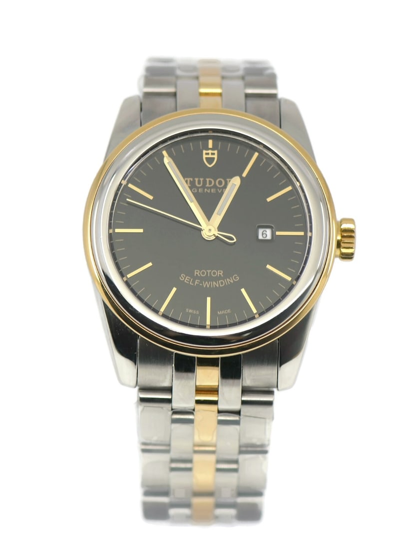 TUDOR Glamour Date 18K Gold Stainless Steel Watch Ref 53003: TUDOR Glamour Date 18K Gold Stainless Steel Watch Ref 53003 Explore the elegance of the Tudor Glamour Date wristwatch, a perfect blend of luxury and functionality. This exquisite timepiece features a 