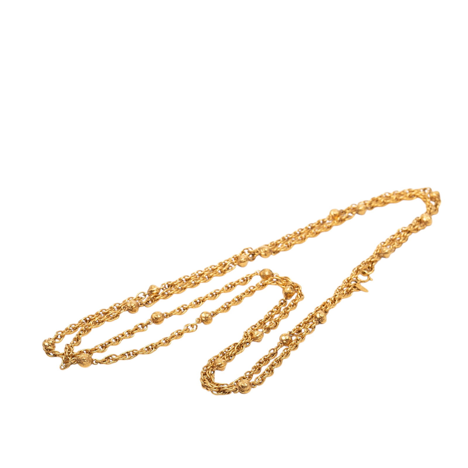 Chanel gold tone station chain long CC necklace: Chanel gold tone station chain long CC necklace This Chanel CC Gold Plated Station Chain Long Necklace features a gold-tone metal chain with a spring ring closure. The necklace is designed in a statio