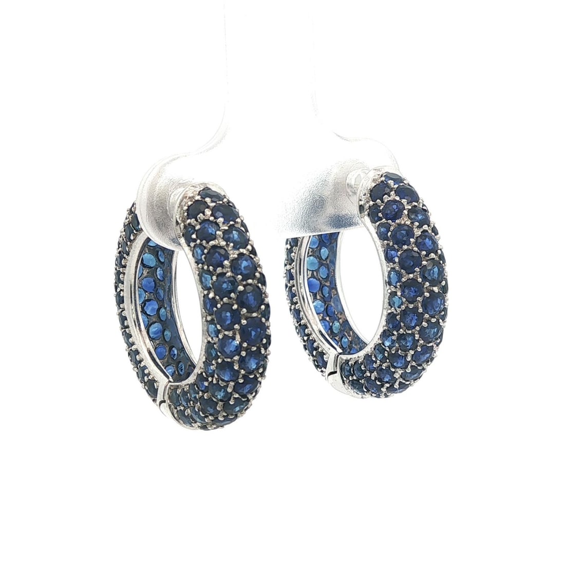18k White Gold Royal Blue Sapphire Pave Hoop Earrings: 18k White Gold Royal Blue Sapphire Pave Hoop Earrings Elevate your jewelry collection with these stunning 18k White Gold Round Pave Royal Blue Sapphire Domed Hoop Huggie Earrings. Crafted from solid 1
