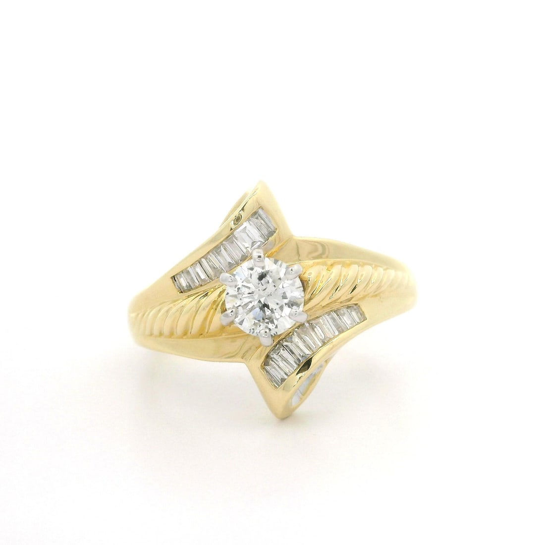 Elegant Solid Yellow Gold 0.83ctw Diamond Bypass Ring: Elegant Solid Yellow Gold 0.83ctw Diamond Bypass Ring This exquisite cocktail ring features a stunning bypass design crafted from solid yellow gold, showcasing a combination of diamonds that totals ap