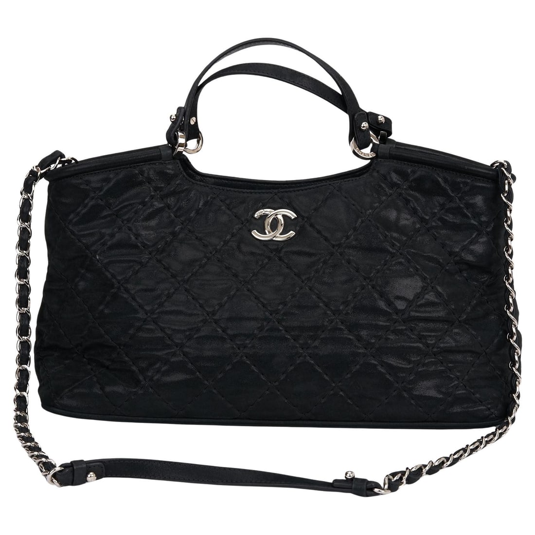 Chanel quilted glazed leather tote bag with chain straps: Chanel quilted glazed leather tote bag with chain straps This Chanel tote is crafted in black diamond-quilted glazed calfskin leather and features silver chain link straps threaded with leather, dual 