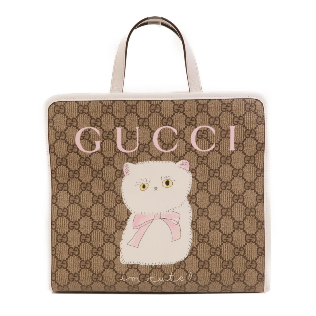 Gucci cat print coated canvas tote bag brown: Gucci cat print coated canvas tote bag brown This GUCCI GG children's tote bag features a playful cat print on durable brown PVC coated canvas. Designed in a classic tote style, it offers a spacious i