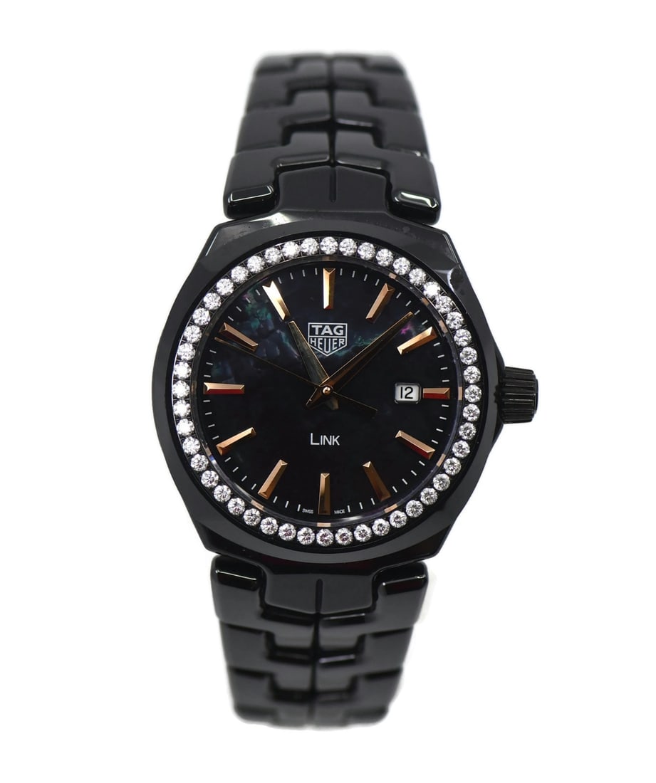TAG Heuer Link WBC1390 Women's Ceramic Diamond Wristwatch: TAG Heuer Link WBC1390 Women's Ceramic Diamond Wristwatch Pre-owned TAG Heuer Link women's wristwatch featuring a black ceramic case and bracelet with a black dial and diamond bezel. This Swiss-made w