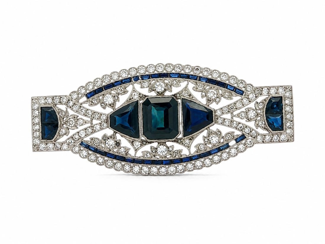 Art Deco French platinum sapphire diamond brooch GIA certified: Art Deco French platinum sapphire diamond brooch GIA certified This French Art Deco brooch features a striking combination of natural blue sapphires and diamonds set in solid platinum. The piece is ad