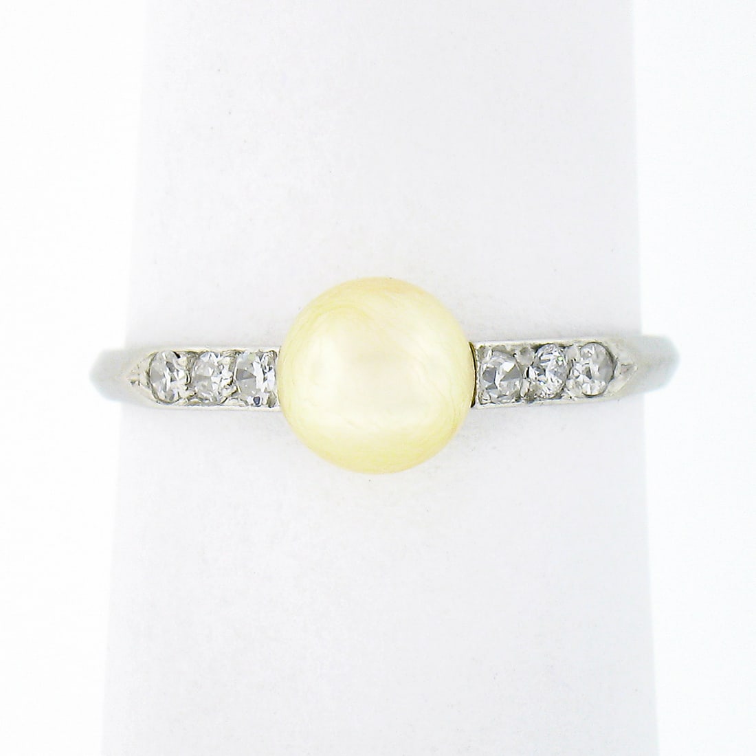 Antique Art Deco 900 Platinum Cultured Pearl Diamond Ring: Antique Art Deco 900 Platinum Cultured Pearl Diamond Ring This exquisite Antique Art Deco ring is crafted from solid .900 platinum, showcasing a beautiful cultured pearl solitaire surrounded by old si