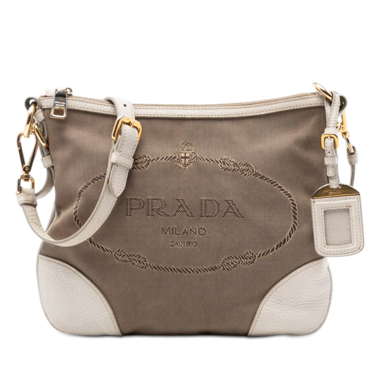 Prada Canapa Logo Brown Canvas Crossbody Bag with Leather Trim: Prada Canapa Logo Brown Canvas Crossbody Bag with Leather Trim This Prada Canvas Canapa Logo Crossbody bag features a durable canvas body with leather trim and an adjustable flat leather strap. It is 