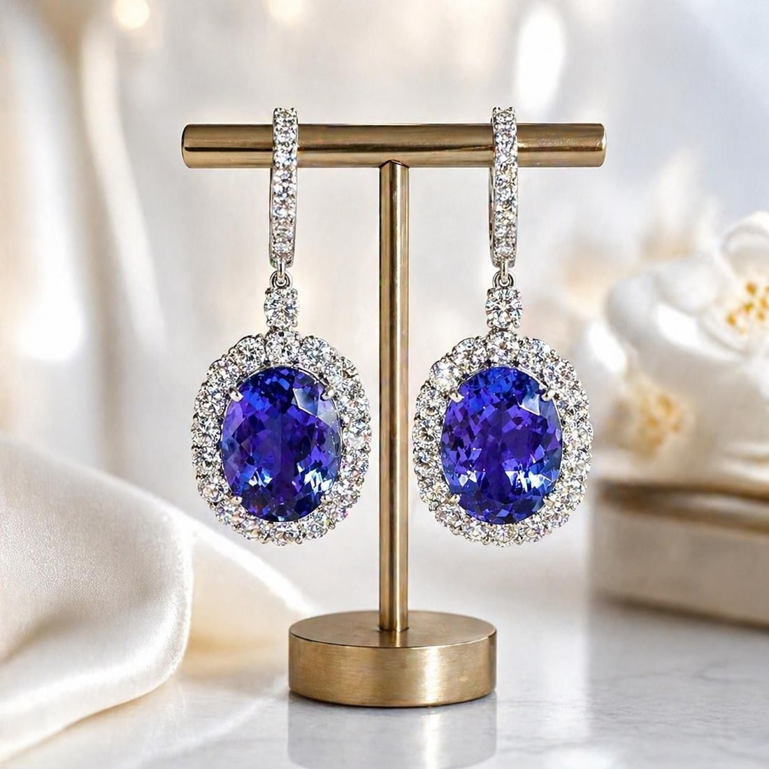 GIA Tanzanite Diamond Drop Earrings 18k White Gold 32.22ctw: GIA Tanzanite Diamond Drop Earrings 18k White Gold 32.22ctw These elegant dangle/drop earrings feature two large, natural tanzanite gemstones in a vivid violet-blue hue, each expertly cut in an oval b