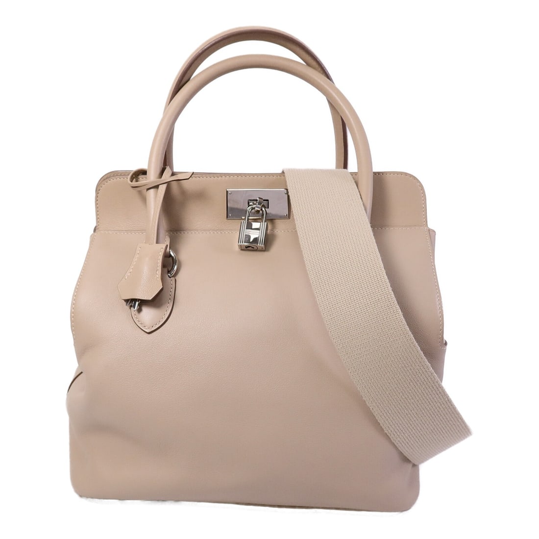 Hermes Toolbox 26 Beige Swift Leather 2 Way Shoulder Bag: Hermes Toolbox 26 Beige Swift Leather 2 Way Shoulder Bag This Hermes Toolbox 26 is a versatile 2-way shoulder bag and handbag crafted from beige calfskin (cowhide) Swift leather. Designed for women, i