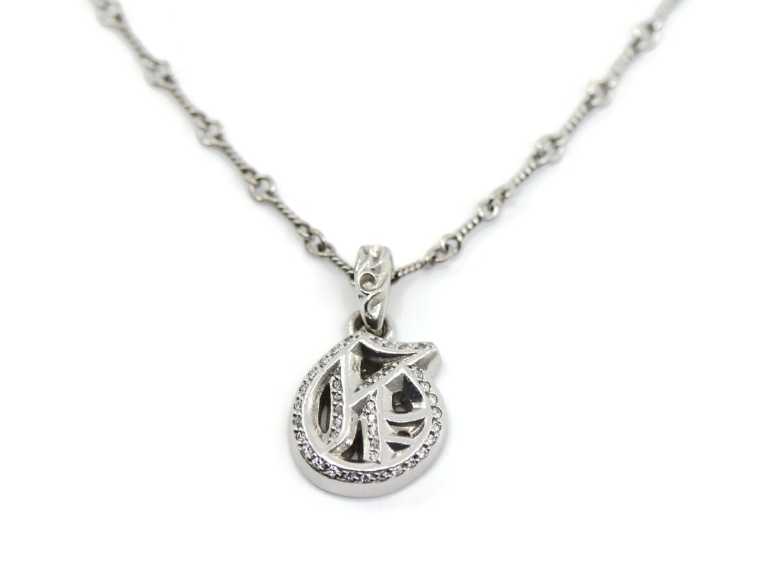 Chrome Hearts Limited Edition 18K White Gold Diamond Necklace: Chrome Hearts Limited Edition 18K White Gold Diamond Necklace This exquisite Chrome Hearts necklace features a stunning pendant design crafted from 18K white gold, ensuring both durability and eleganc