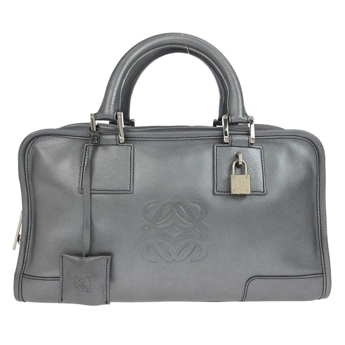 Loewe Amazona 28 silver lambskin top handle bag: Loewe Amazona 28 silver lambskin top handle bag Loewe Amazona 28 top handle handbag in silver lambskin leather. This medium handbag features double leather handles, a zip closure, and interior storage