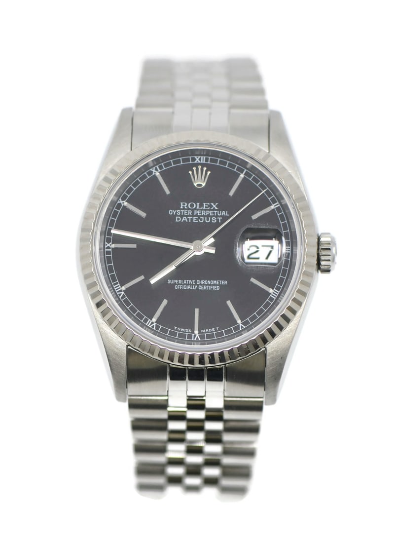 Rolex 16234 Datejust automatic wristwatch black dial with box: Rolex 16234 Datejust automatic wristwatch black dial with box Pre-owned Rolex Datejust wristwatch with a black analog dial, stainless steel case and bracelet, and a fluted silver bezel. This automatic