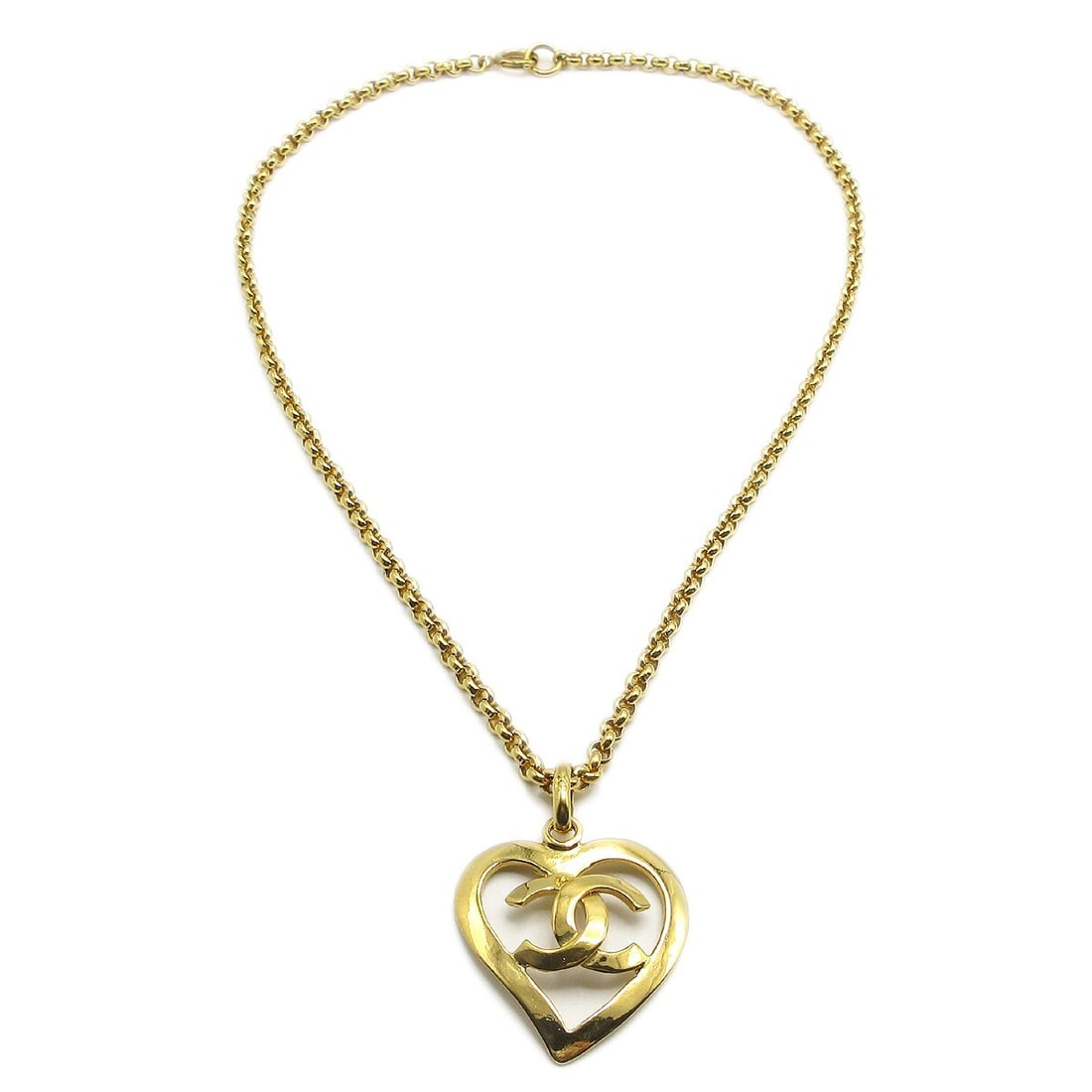 Vintage Chanel 95P Gold Plated Heart Charm Pendant Necklace: Vintage Chanel 95P Gold Plated Heart Charm Pendant Necklace Vintage Chanel pendant necklace featuring a heart-shaped charm with the CC motif. This gold-plated necklace is marked 95P and presents in ve