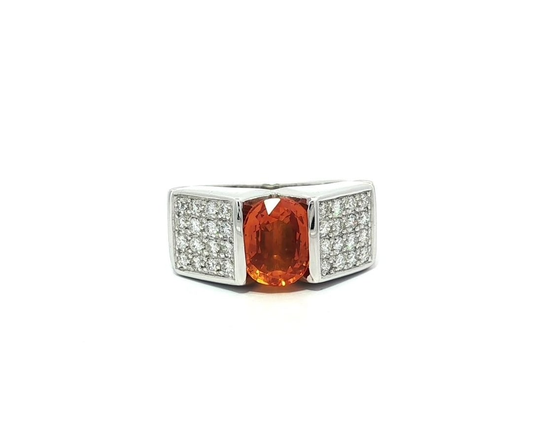 18k White Gold GIA 2.68ctw Channel Set Orange Sapphire Diamond Ring: 18k White Gold GIA 2.68ctw Channel Set Orange Sapphire Diamond Ring This stunning 18k white gold ring features a channel set oval brilliant cut sapphire, weighing 2.22ct, in a vibrant bright orange hu