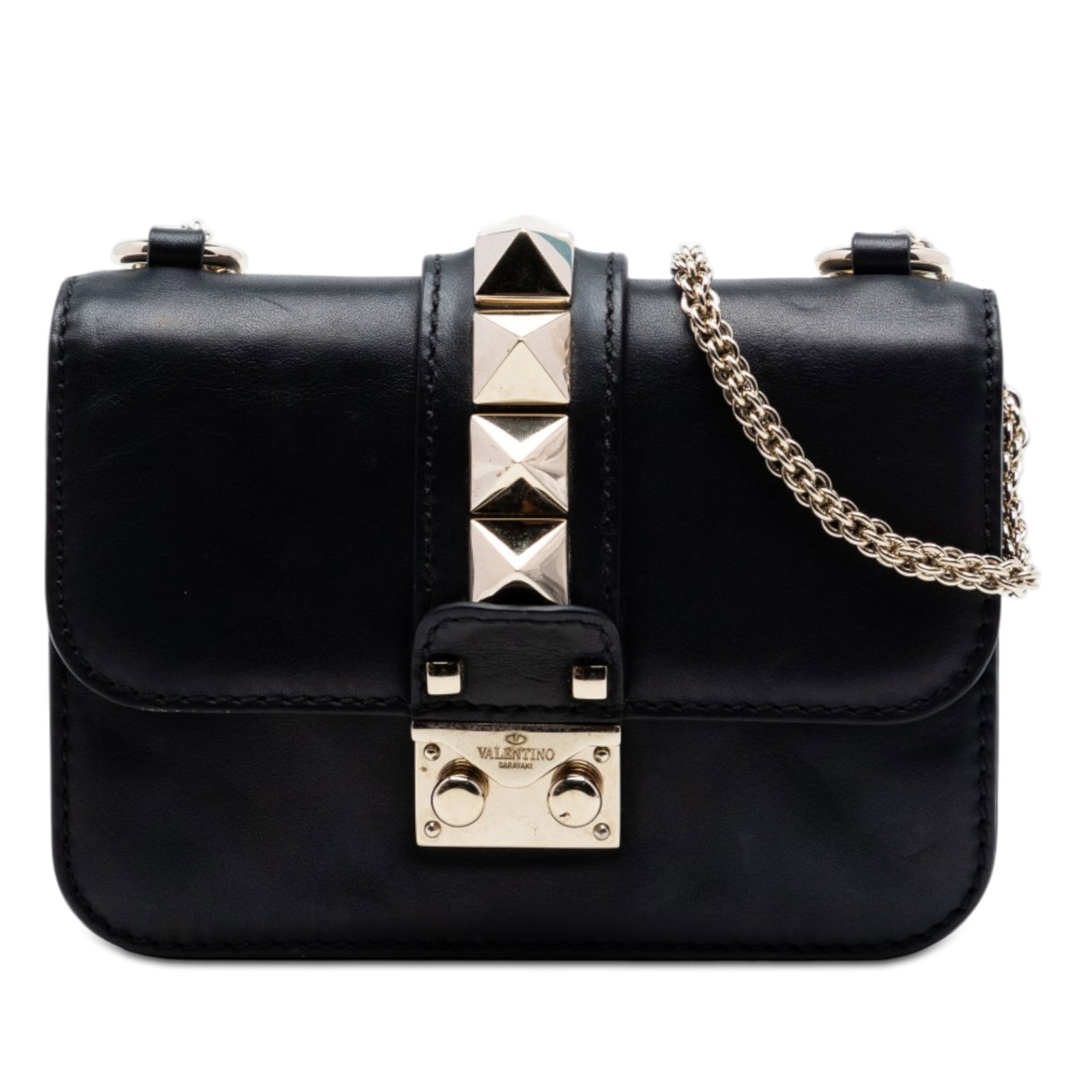 Valentino Rockstud Glam Lock mini leather crossbody bag: Valentino Rockstud Glam Lock mini leather crossbody bag This Valentino Mini Leather Rockstud Glam Lock Crossbody bag features a black leather body accented with signature Rockstud embellishments. It i