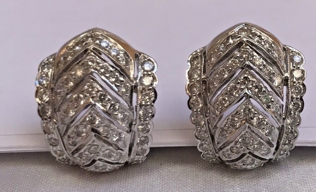 Elegant 18K White Gold Diamond Cuff Earrings by French: Elegant 18K White Gold Diamond Cuff Earrings by French Presenting a stunning pair of earrings crafted from 18K white gold, featuring intricate designs and exceptional workmanship. These cuff-style ear