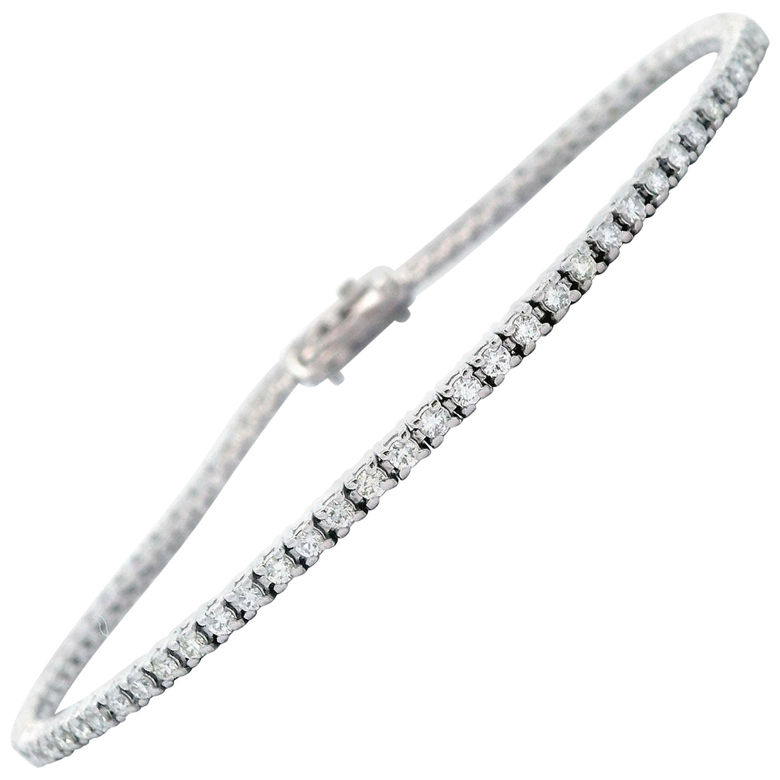 1.31ct D-F Diamond Tennis Bracelet in 18k White Gold: 1.31ct D-F Diamond Tennis Bracelet in 18k White Gold This exquisite tennis bracelet features 80 round brilliant diamonds totaling 1.31 carats, showcasing a stunning D-F color and SI clarity. Each diam