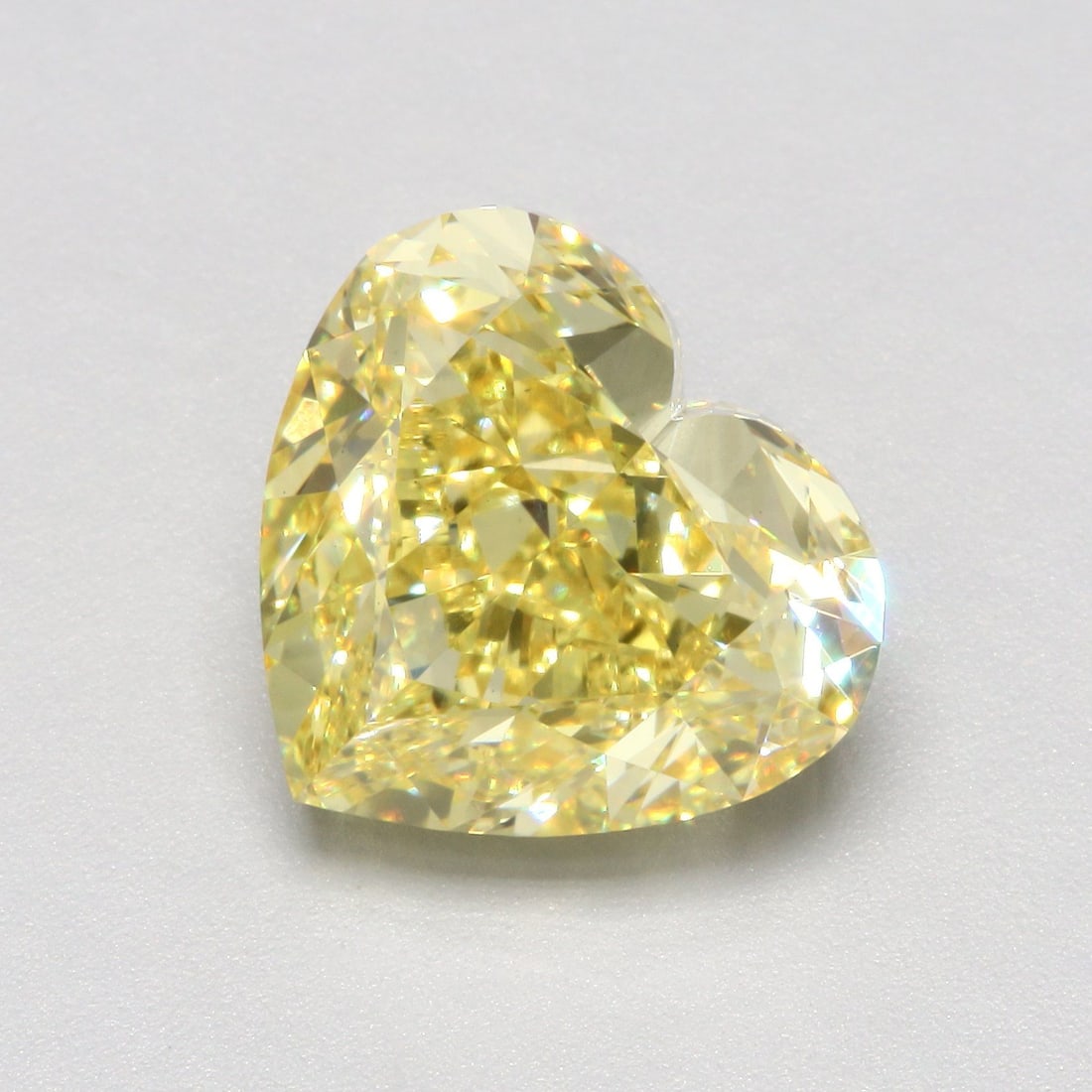 Loose Diamond - HEART 5.51ct Fancy Vivid Yellow VS1: Loose Diamond - HEART 5.51ct Fancy Vivid Yellow VS1 Source: This is a real non-mined Diamond that has been grown in a lab Shape: HEART Carats: 5.51 Color: Fancy Vivid Yellow Certification: IGI Video: