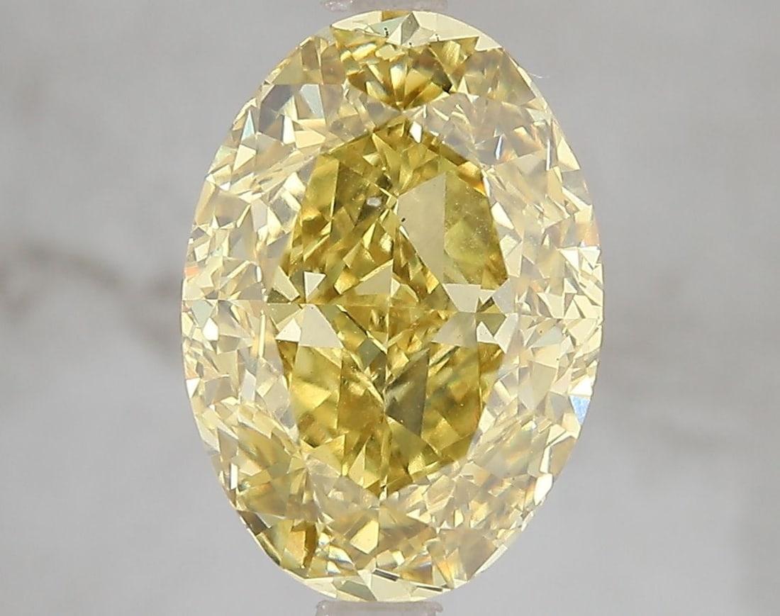 Loose Diamond - OVAL 5.01ct Fancy Vivid Yellow VS2: Loose Diamond - OVAL 5.01ct Fancy Vivid Yellow VS2 Source: This is a real non-mined Diamond that has been grown in a lab Shape: OVAL Carats: 5.01 Color: Fancy Vivid Yellow Certification: IGI Video: