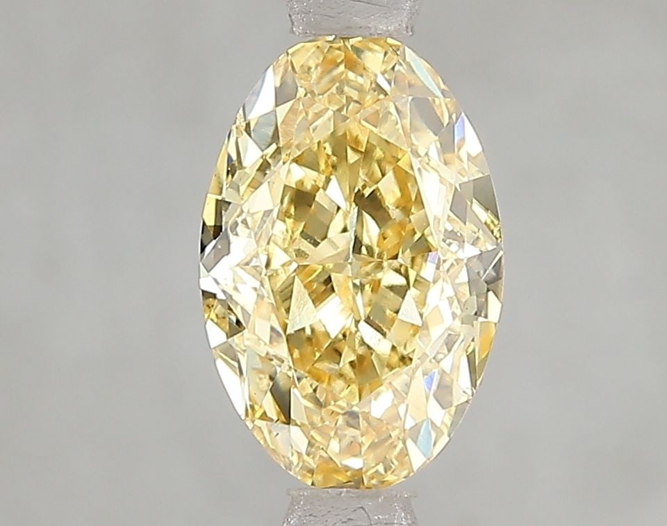 Loose Diamond - OVAL 2.03ct Fancy Vivid Yellow VS2: Loose Diamond - OVAL 2.03ct Fancy Vivid Yellow VS2 Source: This is a real non-mined Diamond that has been grown in a lab Shape: OVAL Carats: 2.03 Color: Fancy Vivid Yellow Certification: IGI Video: