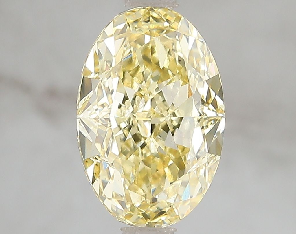 Loose Diamond - OVAL 3.01ct Fancy Vivid Yellow VS1: Loose Diamond - OVAL 3.01ct Fancy Vivid Yellow VS1 Source: This is a real non-mined Diamond that has been grown in a lab Shape: OVAL Carats: 3.01 Color: Fancy Vivid Yellow Certification: IGI Video: