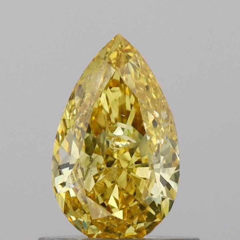 Loose Diamond - PEAR 0.78ct Fancy Vivid Yellow SI2: Loose Diamond - PEAR 0.78ct Fancy Vivid Yellow SI2 Source: This is a real non-mined Diamond that has been grown in a lab Shape: PEAR Carats: 0.78 Color: Fancy Vivid Yellow Certification: IGI Video: