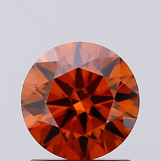 Loose Diamond - ROUND 1.0ct Fancy Vivid Orange VVS1: Loose Diamond - ROUND 1.0ct Fancy Vivid Orange VVS1 Source: This is a real non-mined Diamond that has been grown in a lab Shape: ROUND Carats: 1.0 Color: Fancy Vivid Orange Certification: IGI Video: