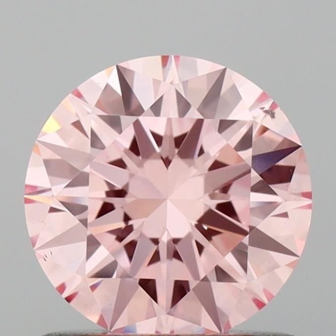 Loose Diamond - ROUND 0.9ct Fancy Intense Pink VS2: Loose Diamond - ROUND 0.9ct Fancy Intense Pink VS2 Source: This is a real non-mined Diamond that has been grown in a lab Shape: ROUND Carats: 0.9 Color: Fancy Intense Pink Certification: IGI Video: