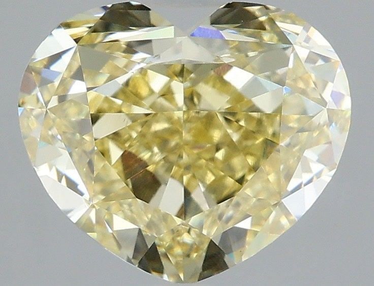 Loose Diamond - HEART 3.03ct Fancy Yellow VS1: Loose Diamond - HEART 3.03ct Fancy Yellow VS1 Source: This is a real non-mined Diamond that has been grown in a lab Shape: HEART Carats: 3.03 Color: Fancy Yellow Certification: IGI Video:
