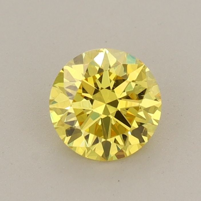 Loose Diamond - ROUND 0.59ct Fancy Vivid Yellow VS2: Loose Diamond - ROUND 0.59ct Fancy Vivid Yellow VS2 Source: This is a real non-mined Diamond that has been grown in a lab Shape: ROUND Carats: 0.59 Color: Fancy Vivid Yellow Certification: IGI Video: