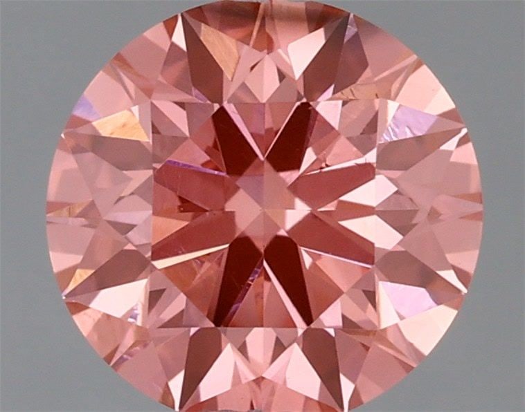 Ideal Loose Diamond - ROUND 0.9ct Fancy Vivid Pink SI1: Ideal Loose Diamond - ROUND 0.9ct Fancy Vivid Pink SI1 Source: This is a real non-mined Diamond that has been grown in a lab Shape: ROUND Carats: 0.9 Color: Fancy Vivid Pink Certification: IGI Video: