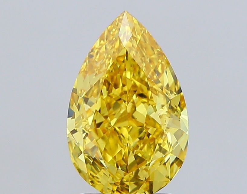Loose Diamond - PEAR 3.1ct Fancy Vivid Yellow VS1: Loose Diamond - PEAR 3.1ct Fancy Vivid Yellow VS1 Source: This is a real non-mined Diamond that has been grown in a lab Shape: PEAR Carats: 3.1 Color: Fancy Vivid Yellow Certification: IGI Video: