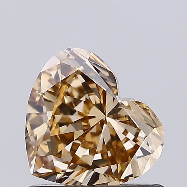 Loose Diamond - HEART 0.73ct Fancy Light Brown VS1: Loose Diamond - HEART 0.73ct Fancy Light Brown VS1 Source: This is a real non-mined Diamond that has been grown in a lab Shape: HEART Carats: 0.73 Color: Fancy Light Brown Certification: IGI Video: