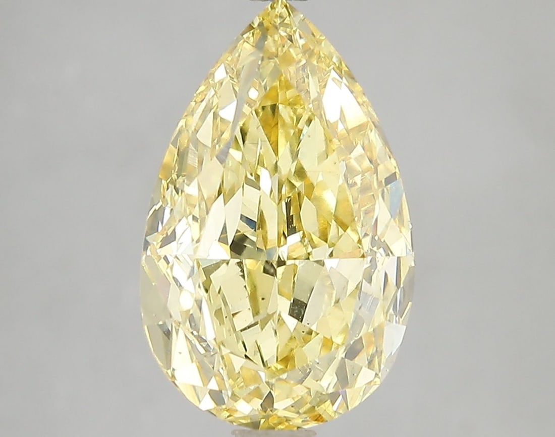 Loose Diamond - PEAR 5.52ct Fancy Vivid Yellow VS2: Loose Diamond - PEAR 5.52ct Fancy Vivid Yellow VS2 Source: This is a real non-mined Diamond that has been grown in a lab Shape: PEAR Carats: 5.52 Color: Fancy Vivid Yellow Certification: IGI Video: