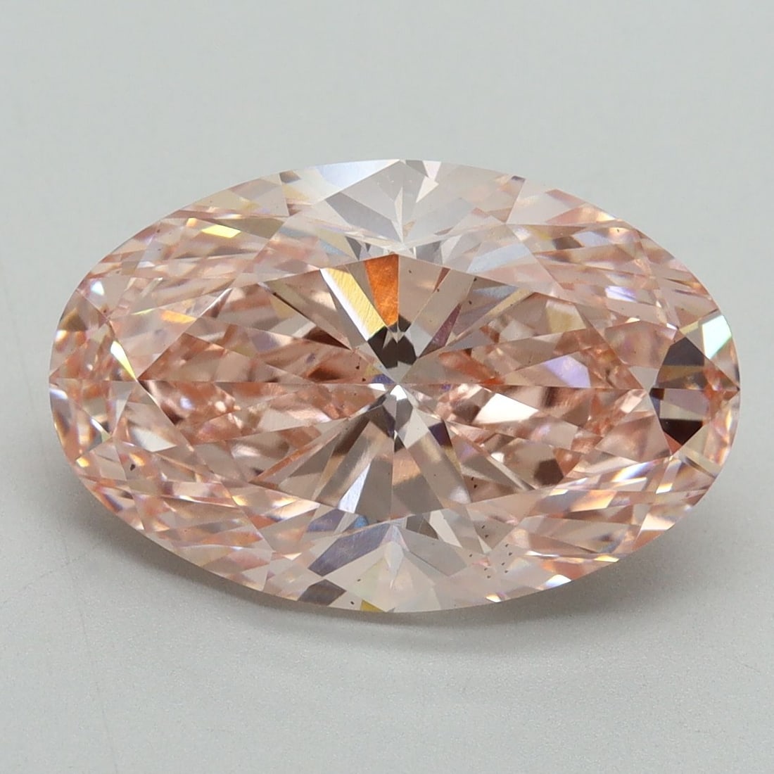 Loose Diamond - OVAL 6.19ct Fancy Vivid Pink VS2: Loose Diamond - OVAL 6.19ct Fancy Vivid Pink VS2 Source: This is a real non-mined Diamond that has been grown in a lab Shape: OVAL Carats: 6.19 Color: Fancy Vivid Pink Certification: IGI Video: