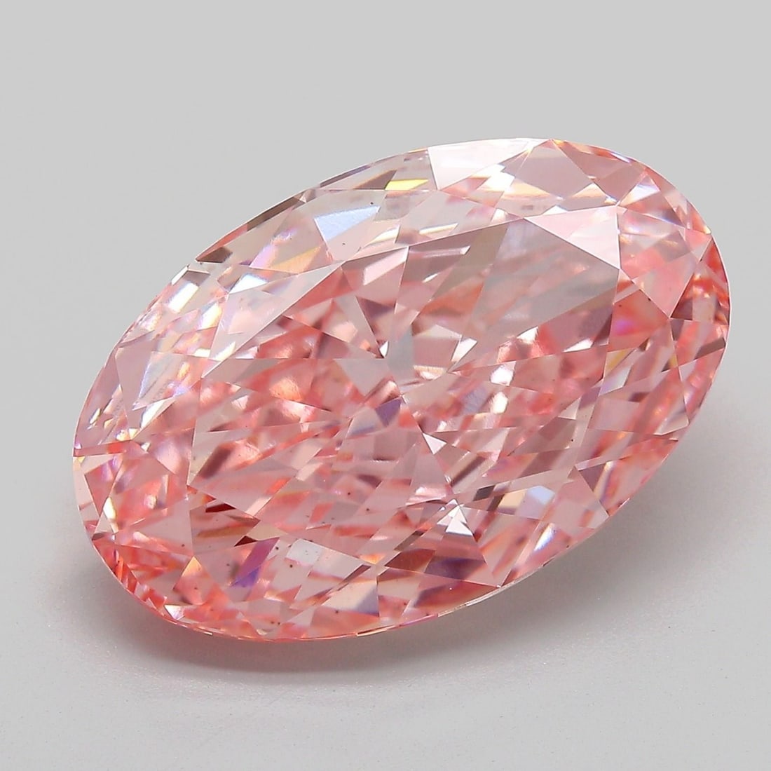 Loose Diamond - OVAL 11.08ct Fancy Vivid Pink VS1: Loose Diamond - OVAL 11.08ct Fancy Vivid Pink VS1 Source: This is a real non-mined Diamond that has been grown in a lab Shape: OVAL Carats: 11.08 Color: Fancy Vivid Pink Certification: IGI Video: