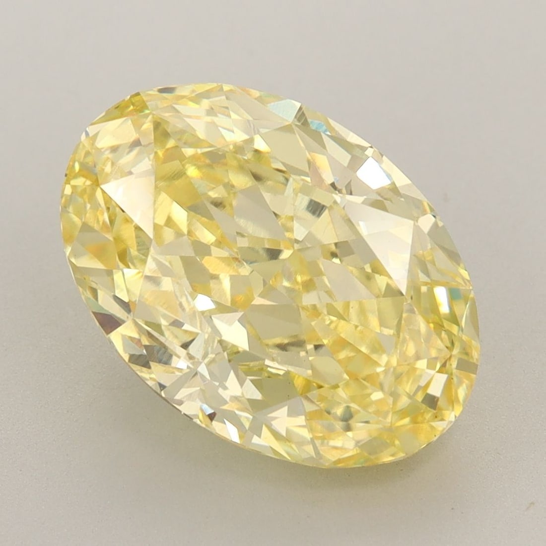 Loose Diamond - OVAL 6.12ct Fancy Vivid Yellow VS1: Loose Diamond - OVAL 6.12ct Fancy Vivid Yellow VS1 Source: This is a real non-mined Diamond that has been grown in a lab Shape: OVAL Carats: 6.12 Color: Fancy Vivid Yellow Certification: IGI Video: